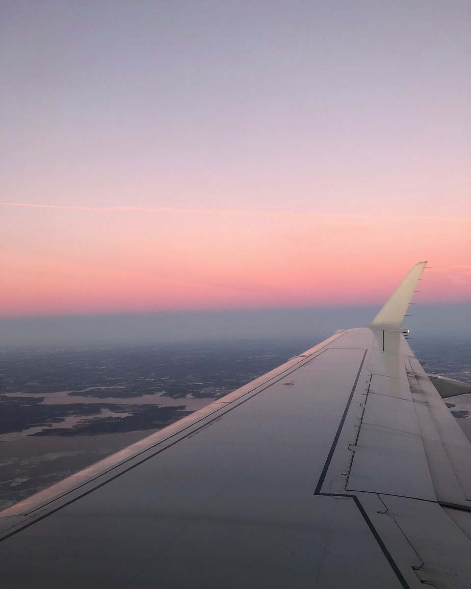 sunset white airplane wing sky