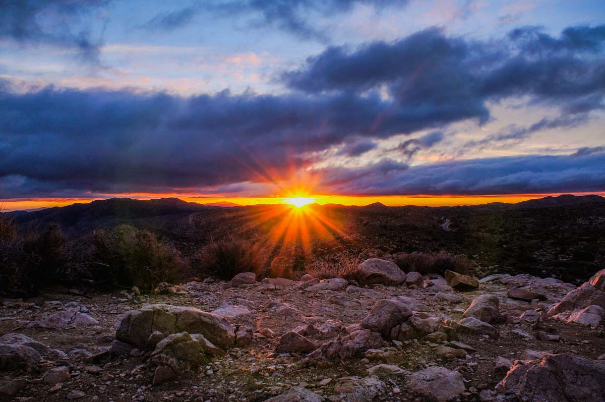 sky mountain range under cloudy sky during sunset sunrise