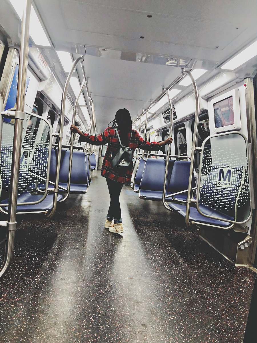 train woman standing inside train train station
