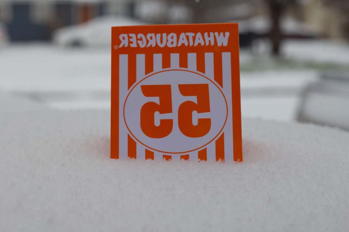 abilene orange and white stop sign on white snow united states