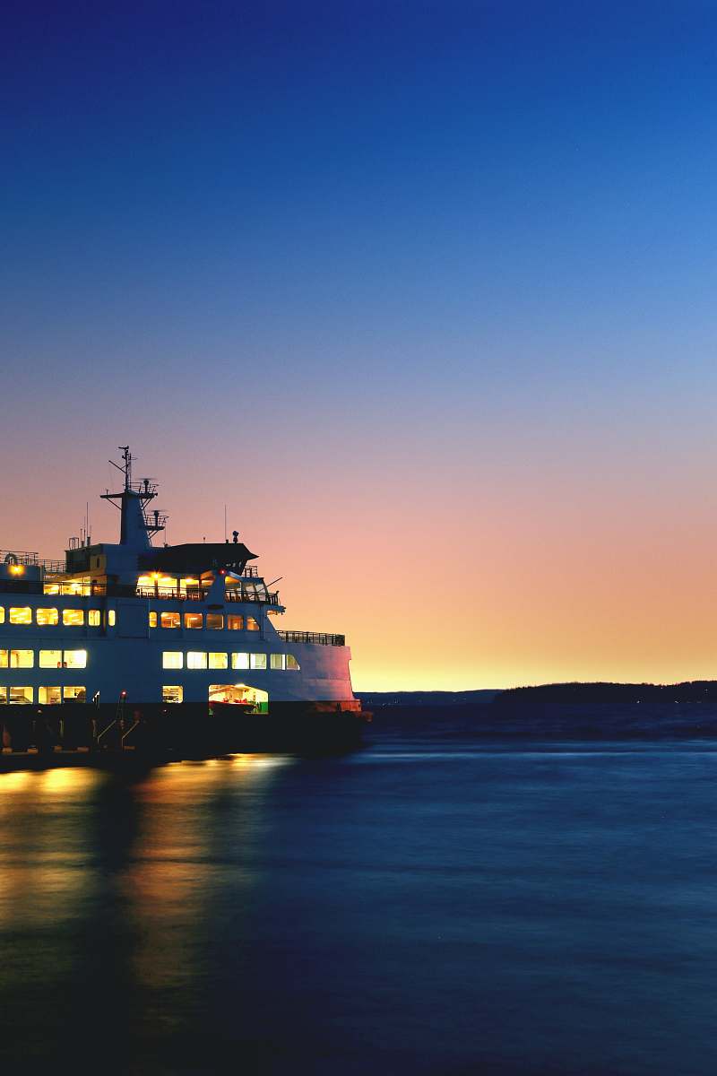 ferry lighted cruiseship on sea taken during golden hour boat