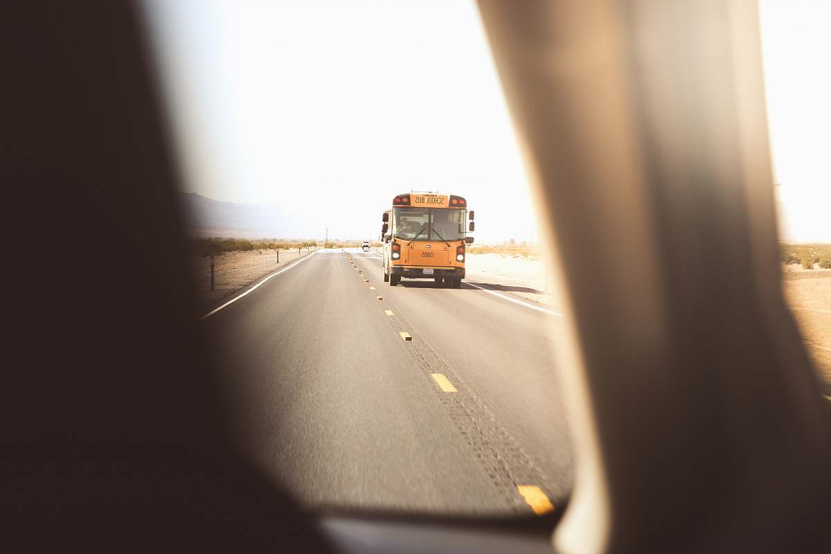 bus yellow class a motorhome on roadway school bus