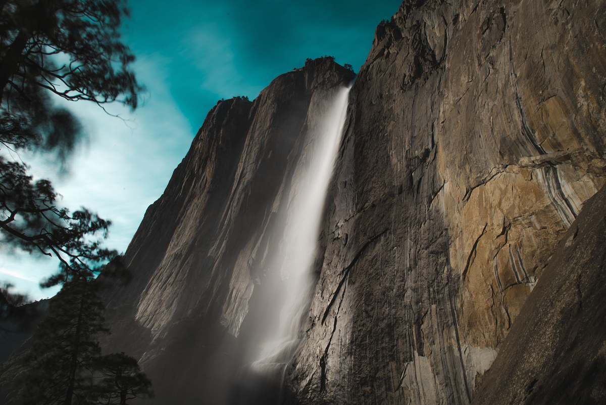 mountain low angle photo of waterfalls outdoors