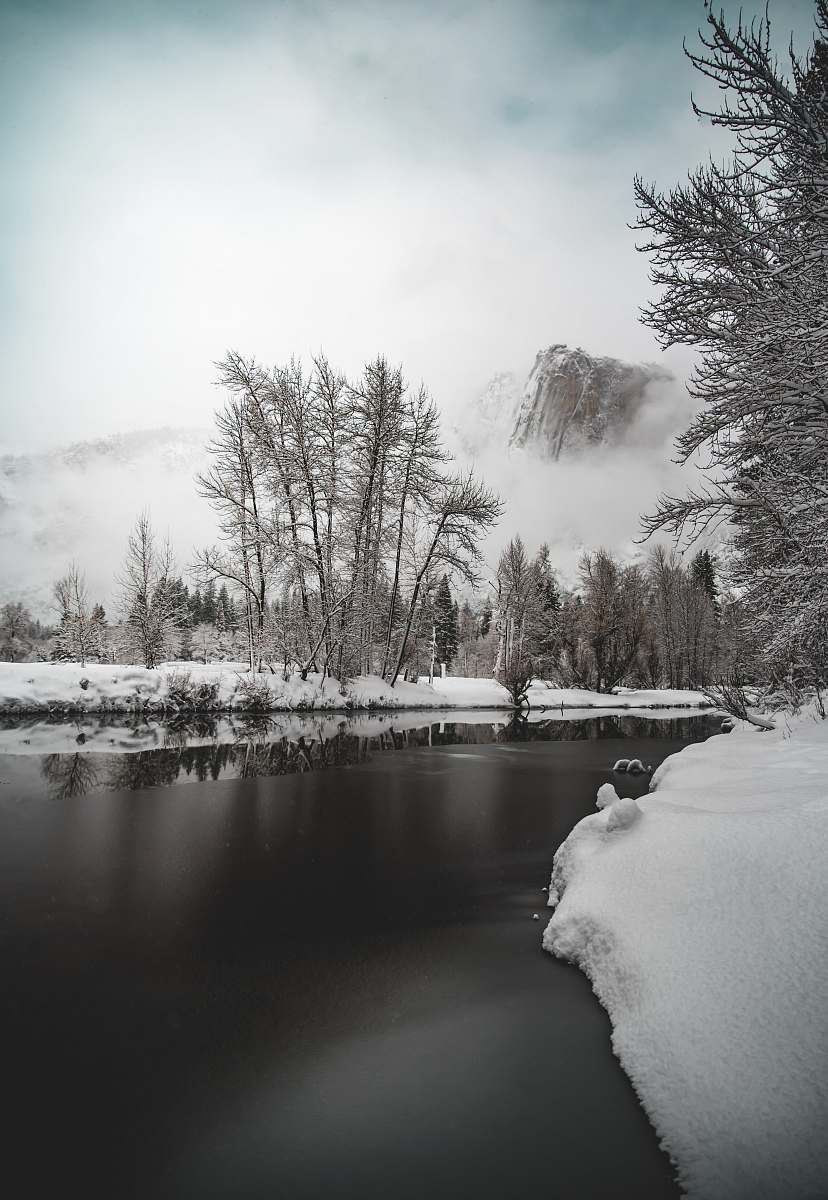 snow photo of river near snow field ice
