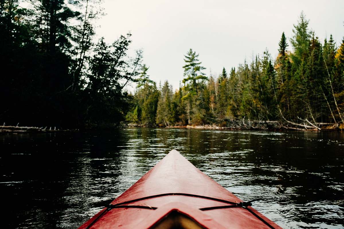 boat red kayak on river canoe