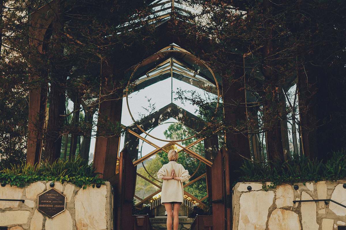 yoga woman standing near green leafed plants building