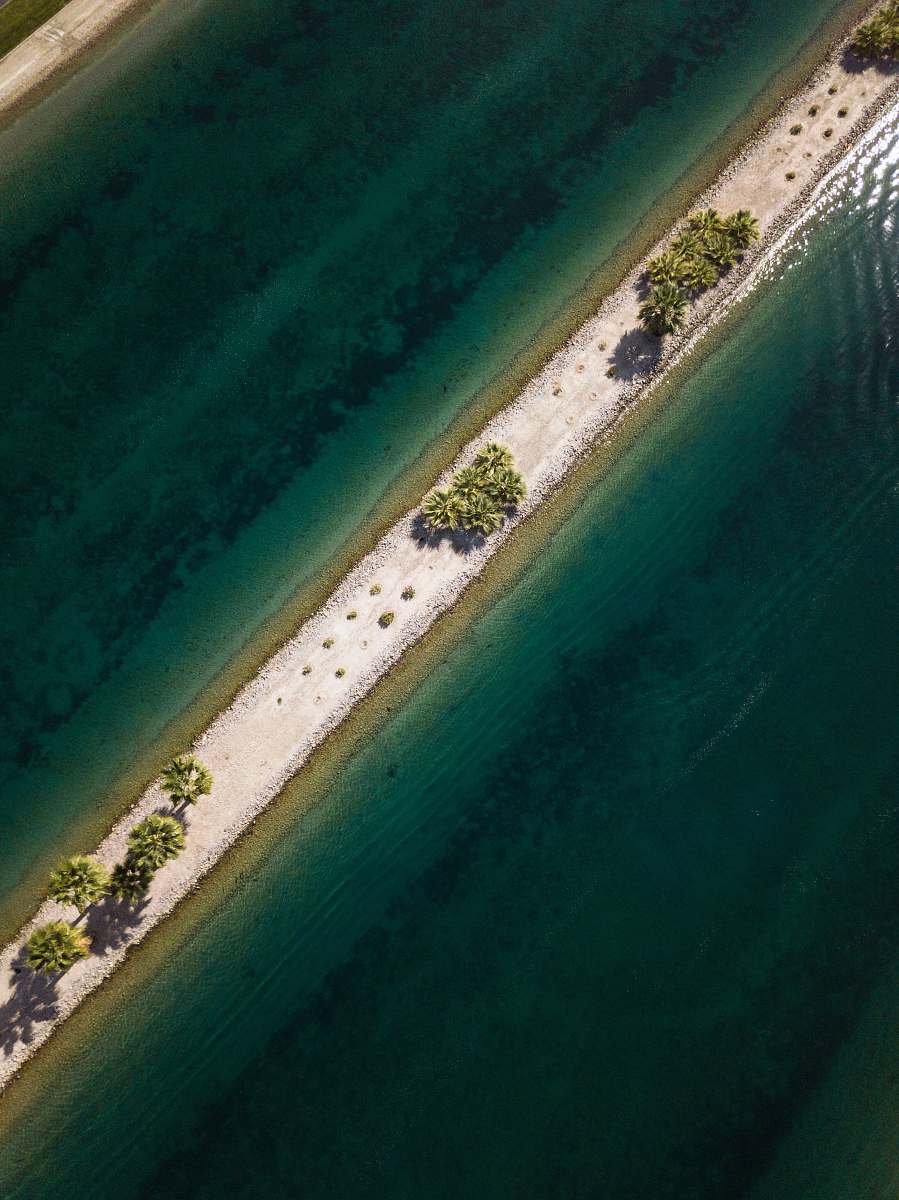 indio aerial view of body of water and green leafed trees lake
