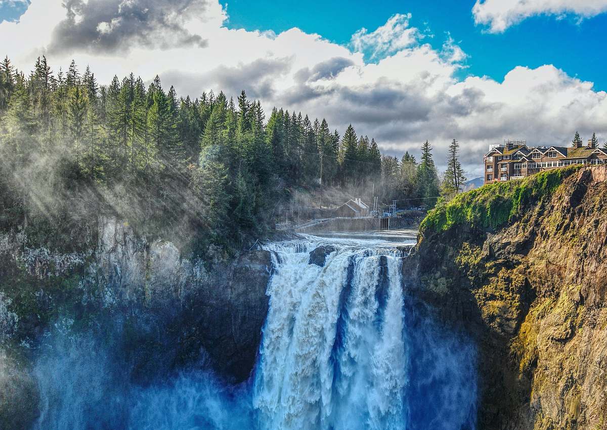 waterfall brown and white building beside waterfalls snoqualmie