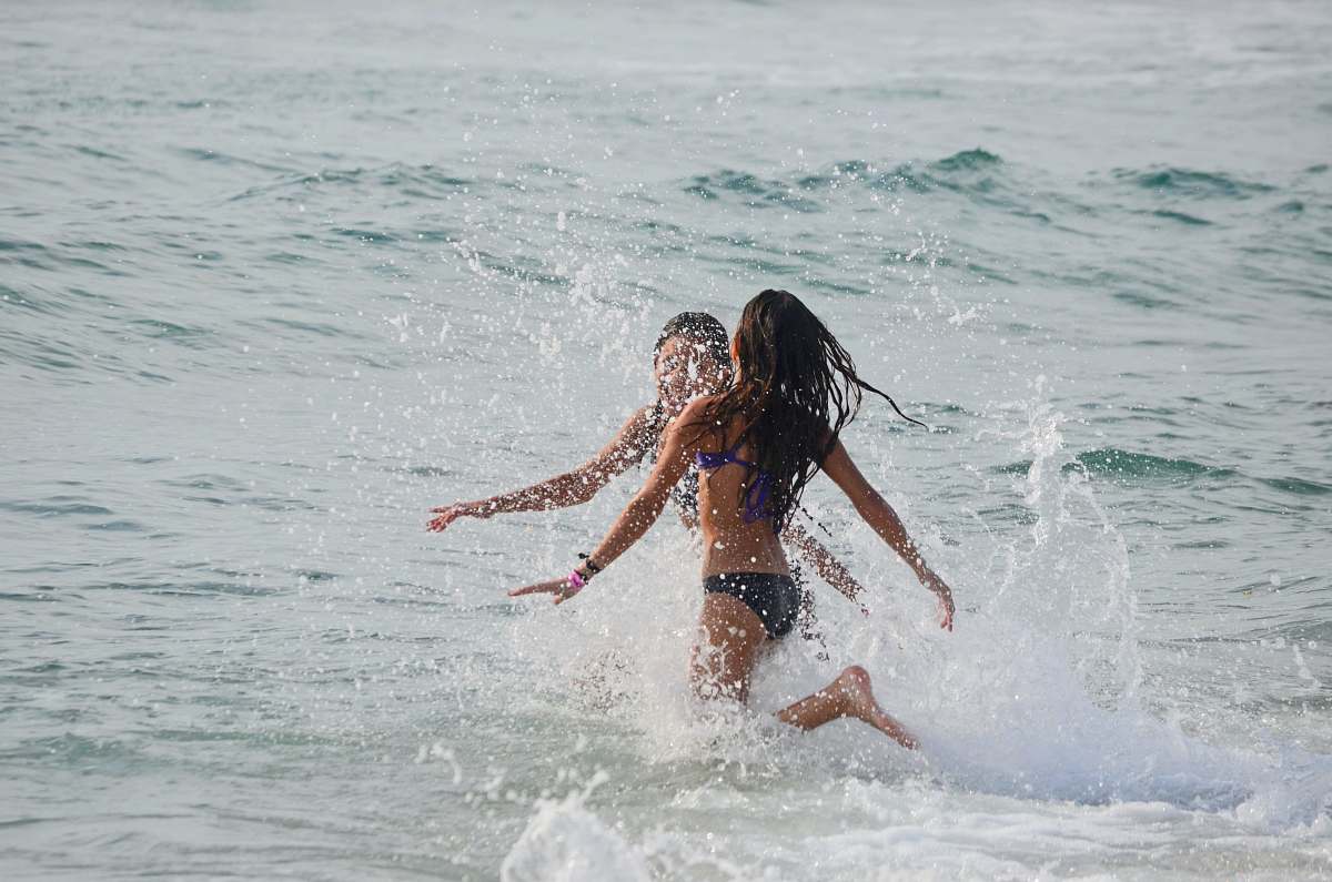 ocean two women walking on body of water play