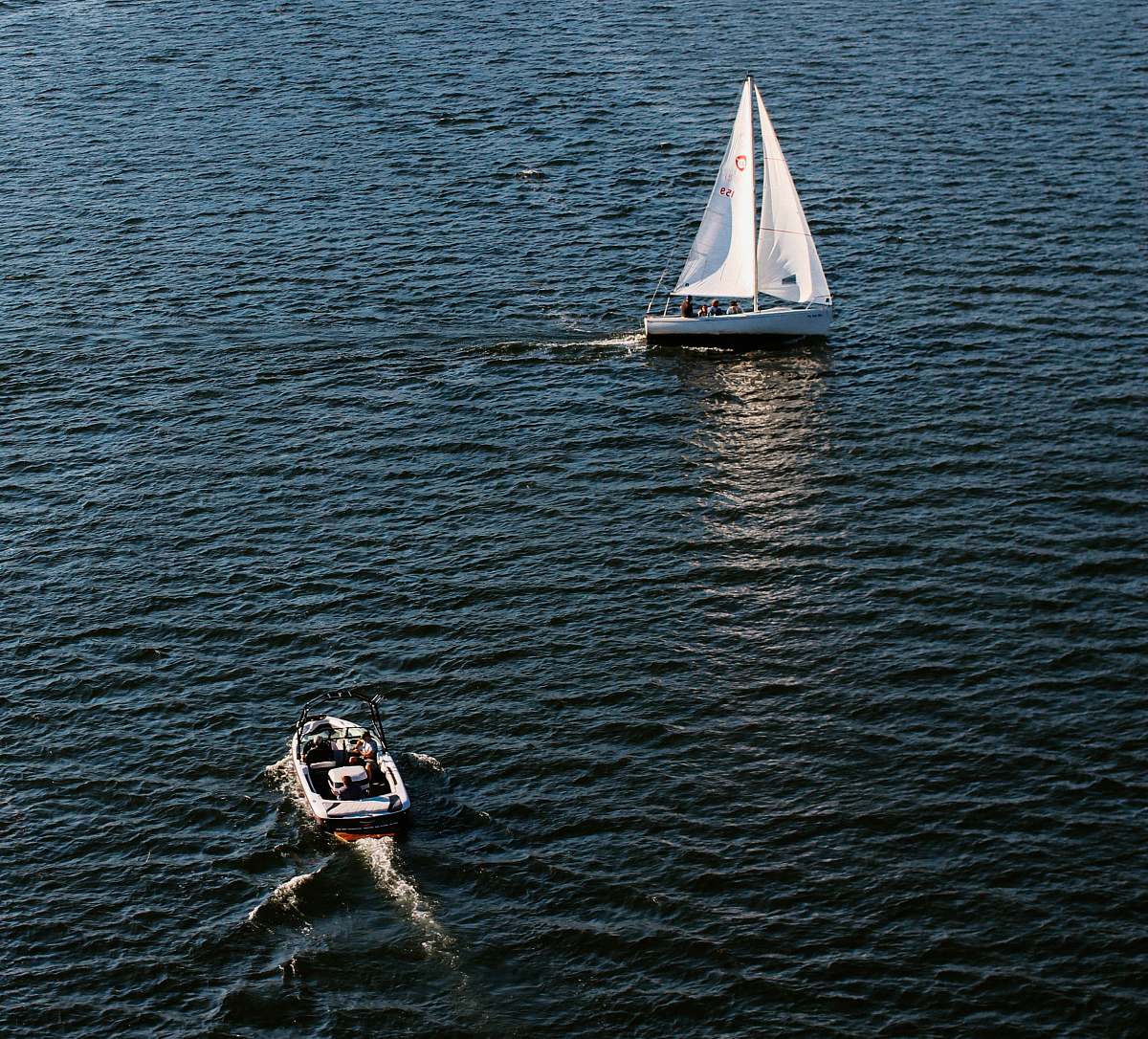 boat two white motorboats floating on water at daytime yacht