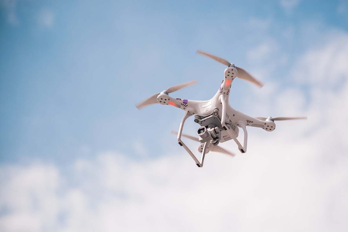 bird selective-focus photography of quadcopter flying