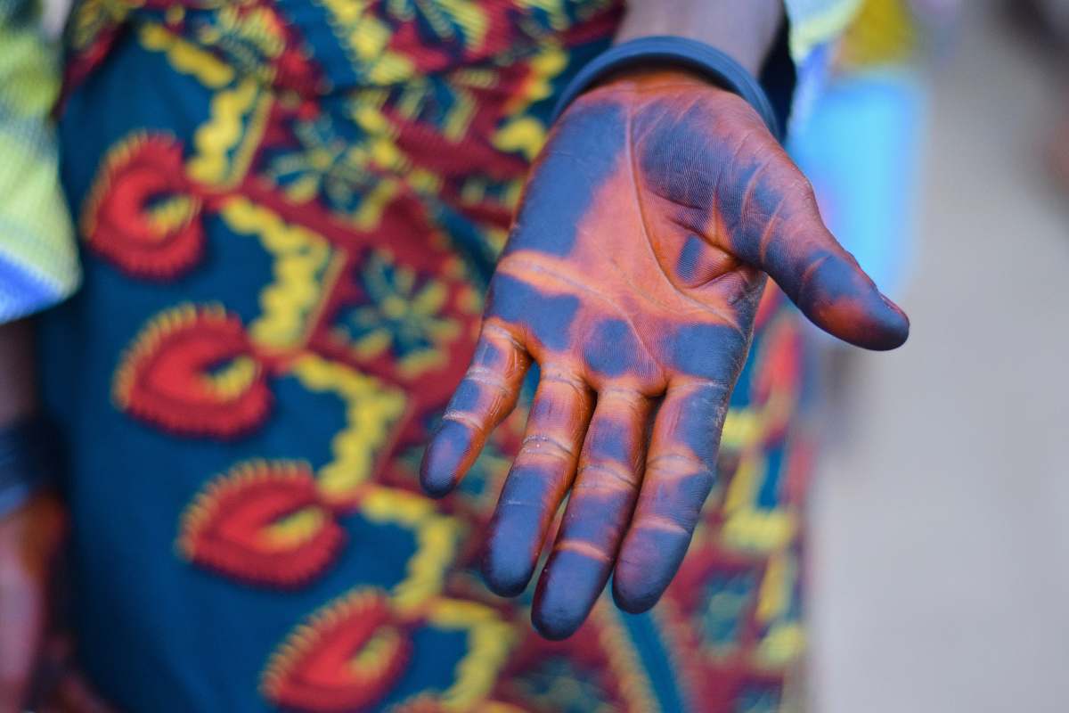 nigeria person's blue hand paint africa