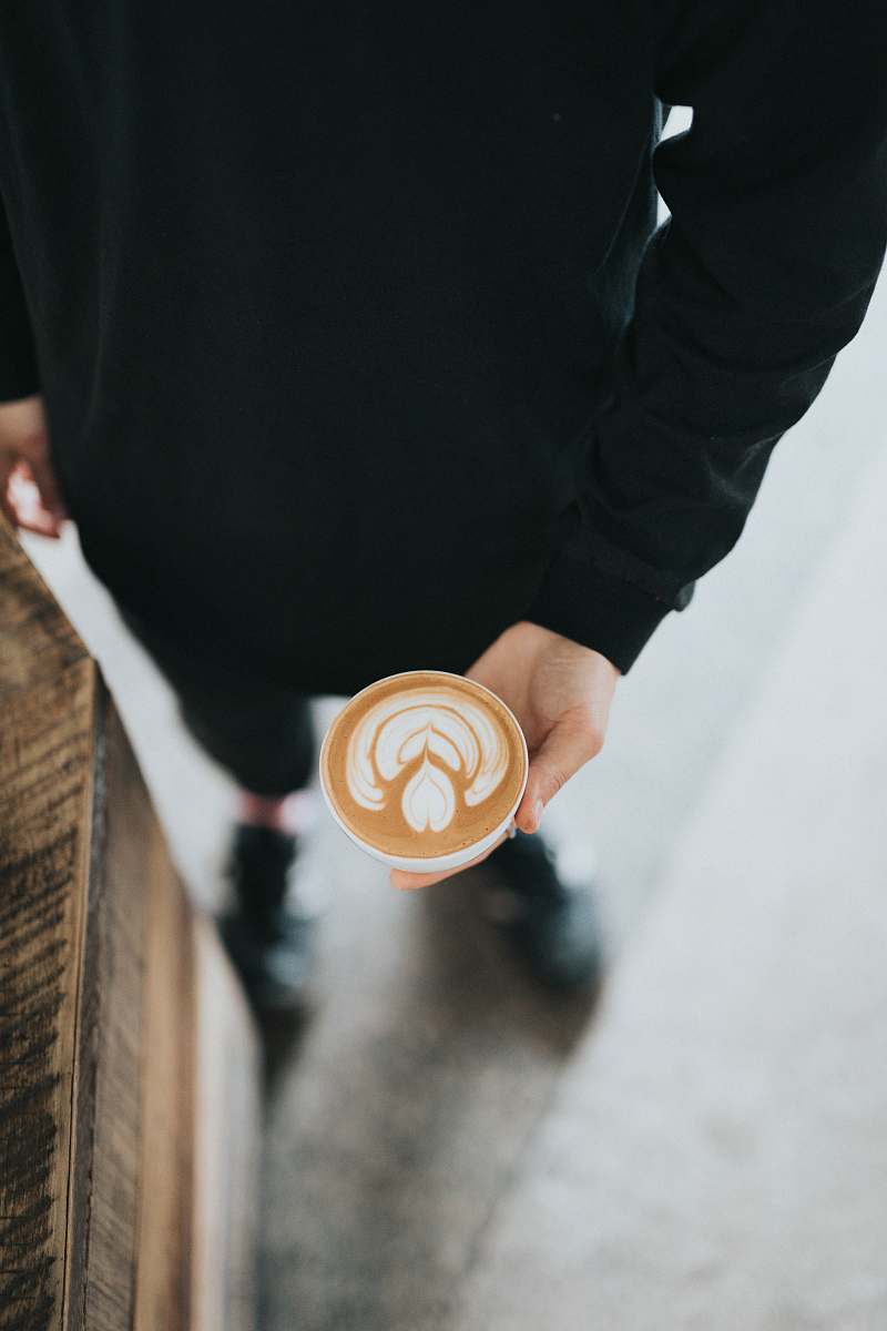 hand person holding cup filled with coffee coffee