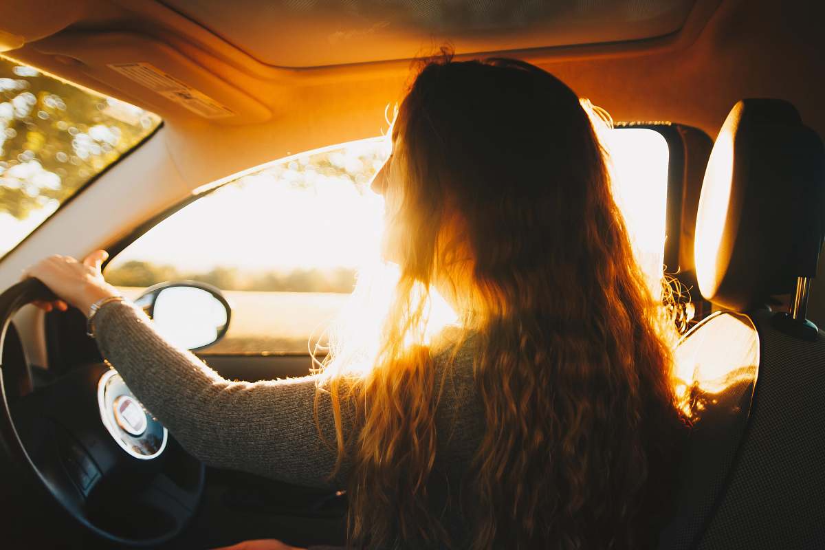 flame woman driving car fire