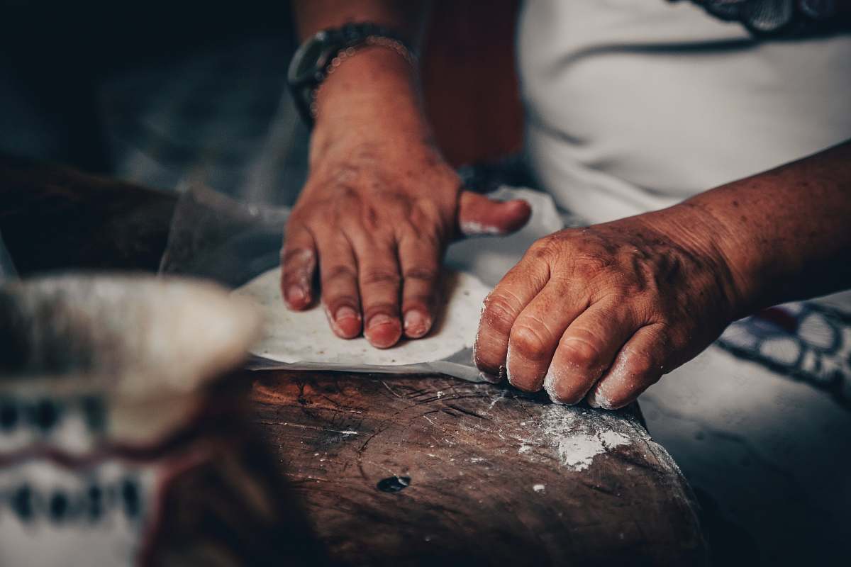 human man making roti person