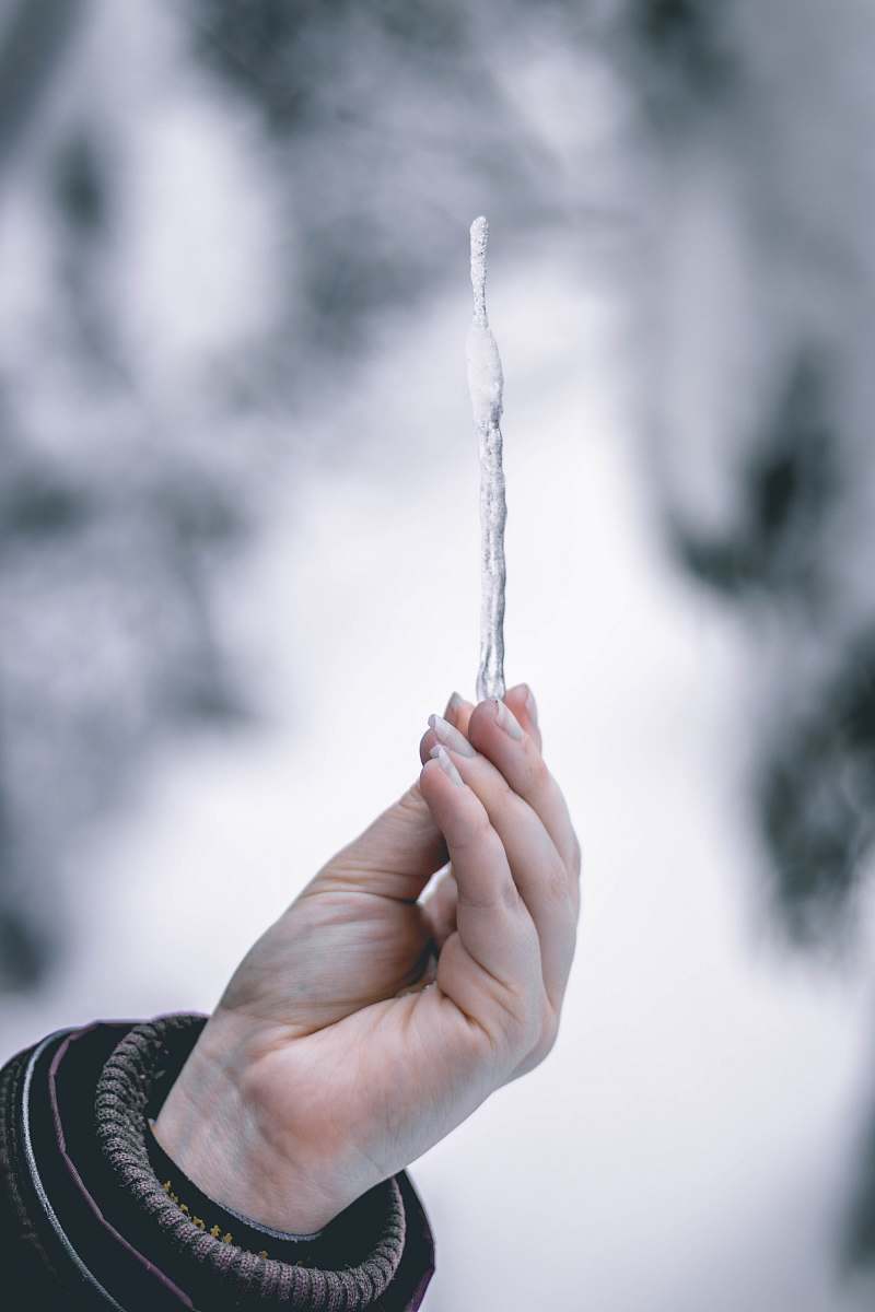 person person holding icicle human