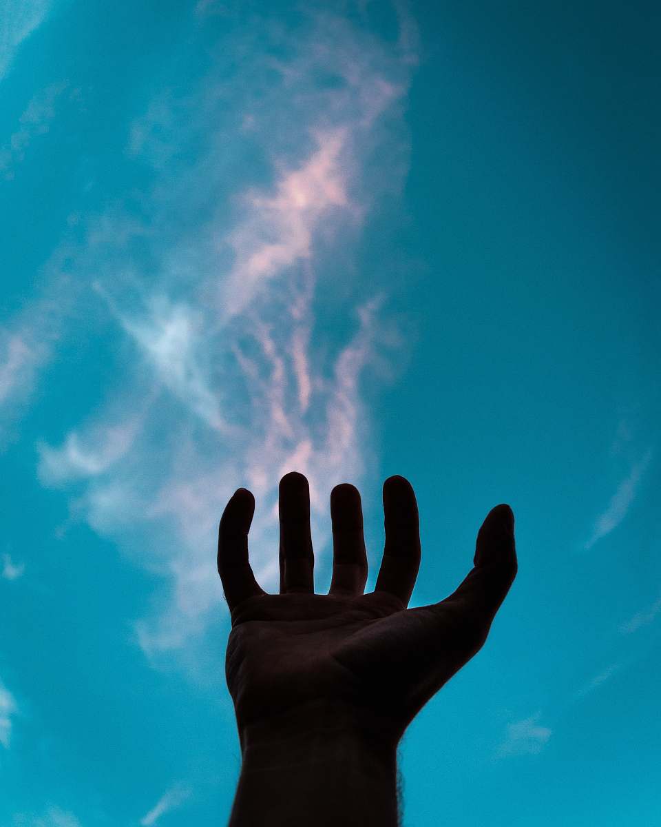 human person raising their left hand person