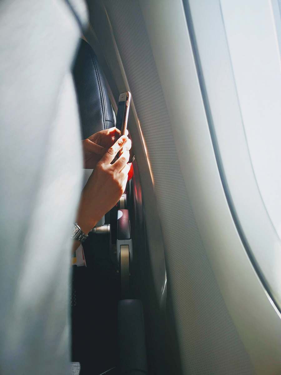 human shallow focus photo of person holding Android smartphone hand