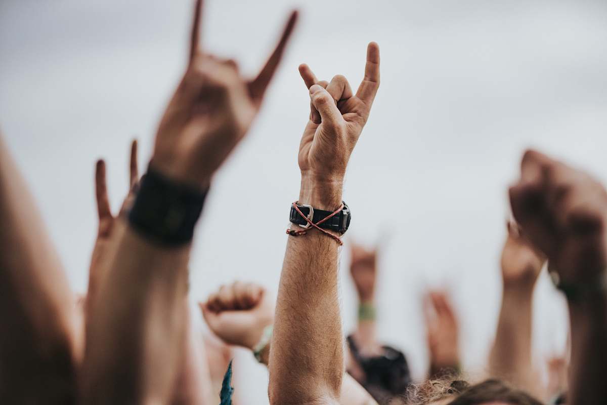 human sign of the horns close up photography person