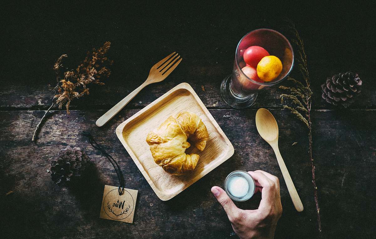 meal person holding condiment bottle breakfast