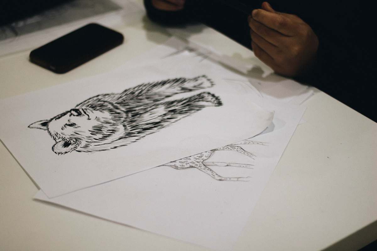 hand person near white printer paper fist