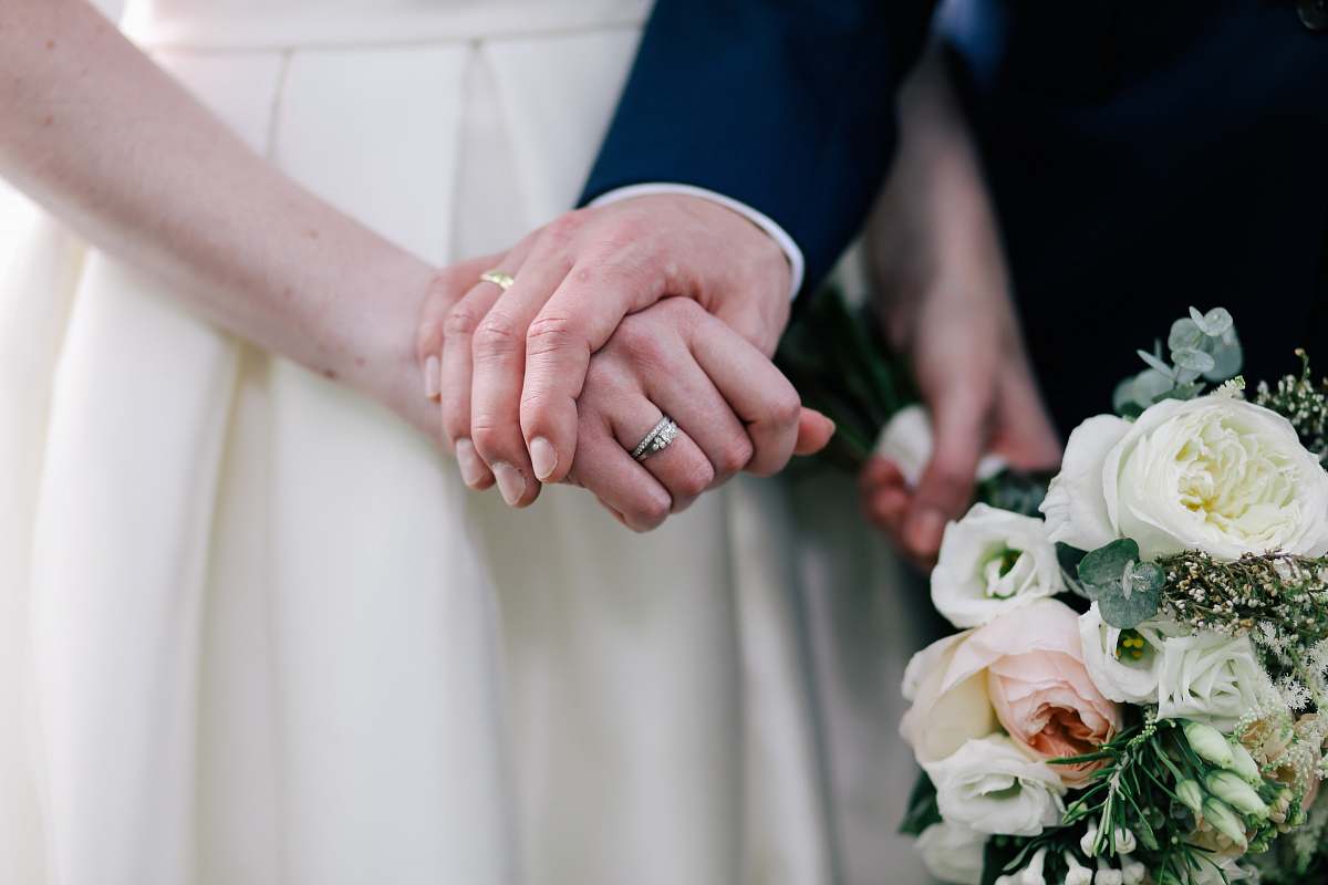 flower close up photo of man holding woman's hand blossom