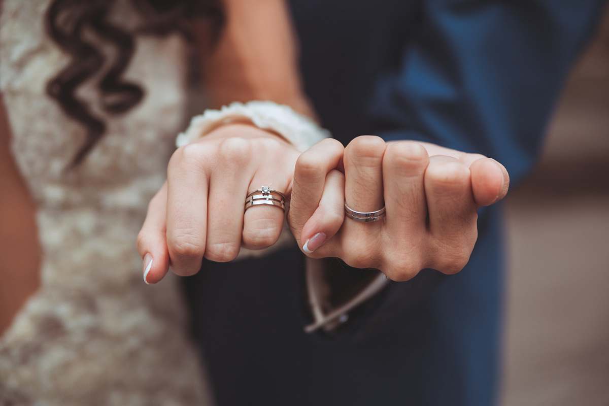 human couple holding each other's hands person