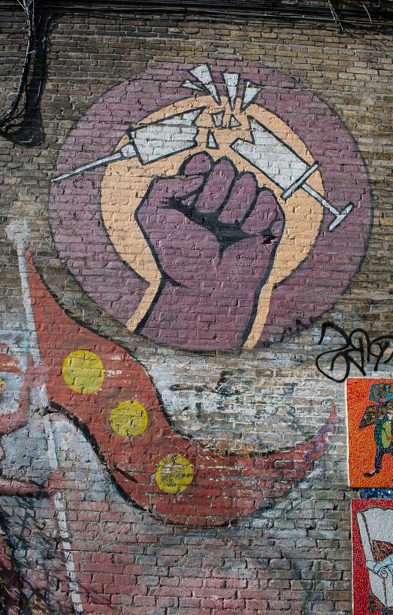 rug human fist grafiti brick