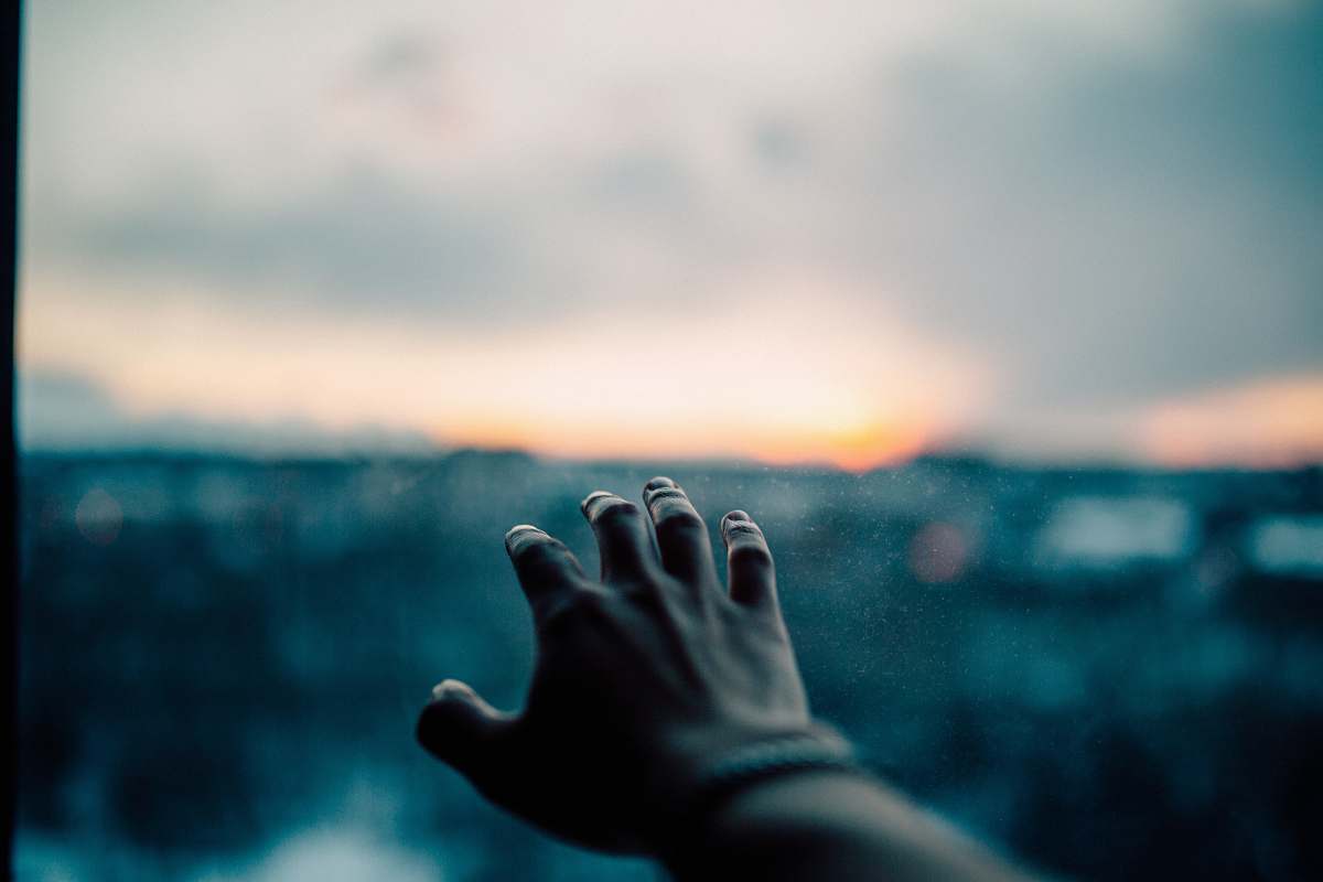 sunset human left hand bokeh