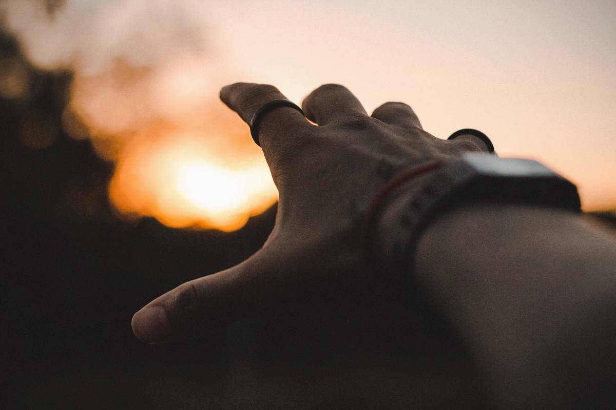 brazil left person's hand pointing yellow light light