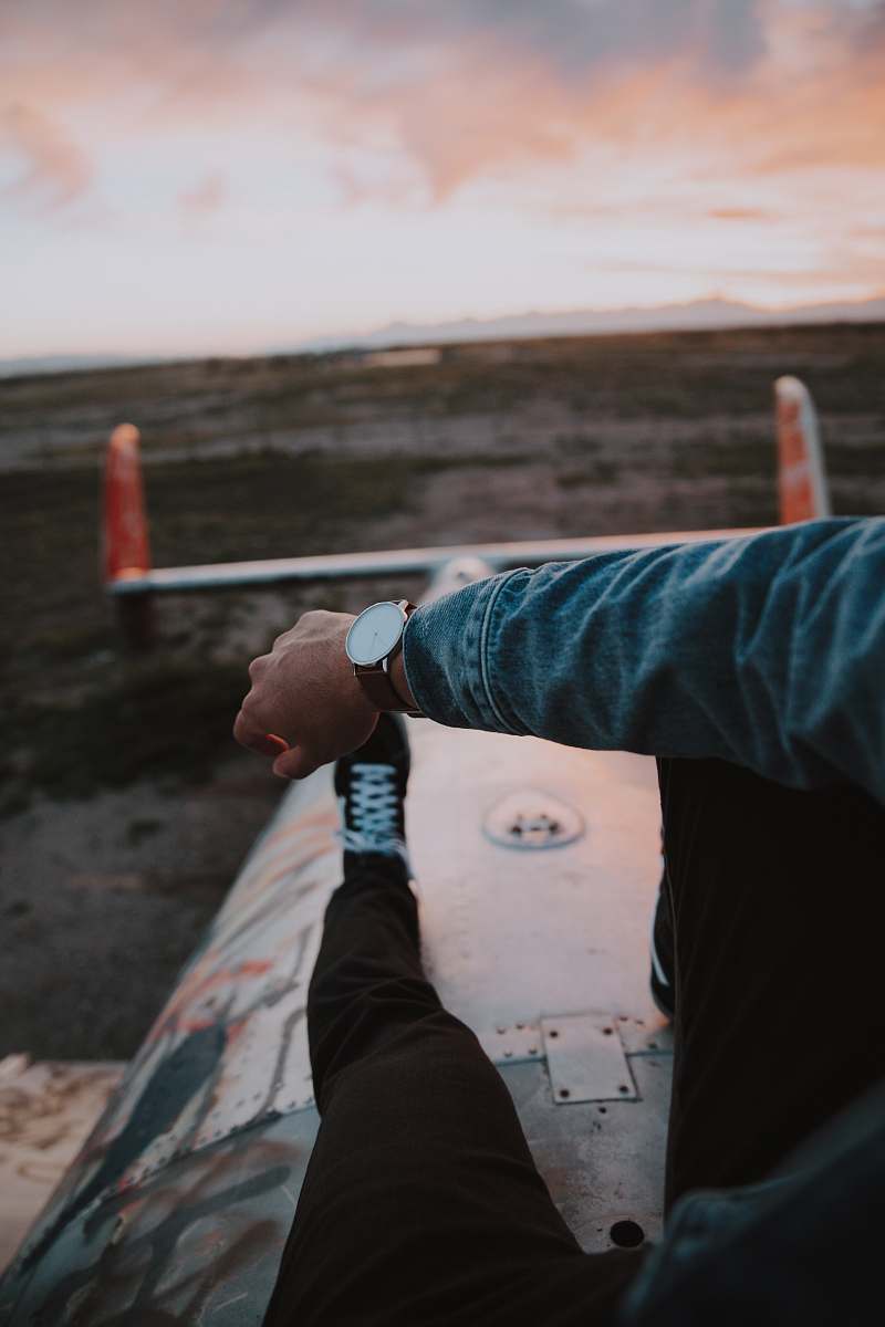 human man sitting on metal platform person