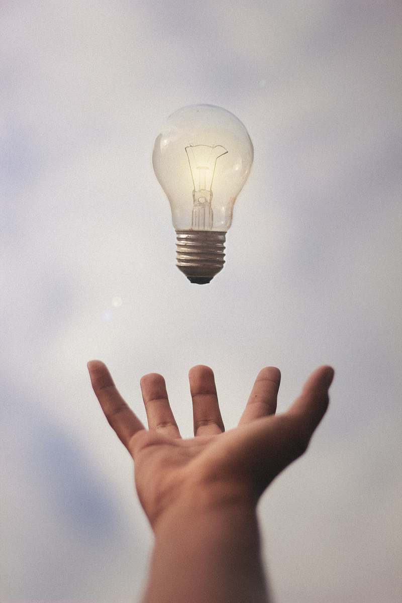 light-person-catching-light-bulb-lightbulb-image-free-photo