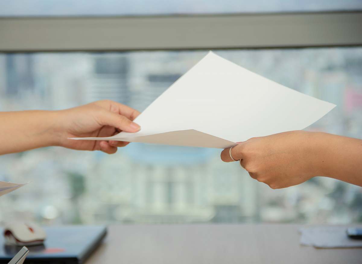 person person handing over paper human