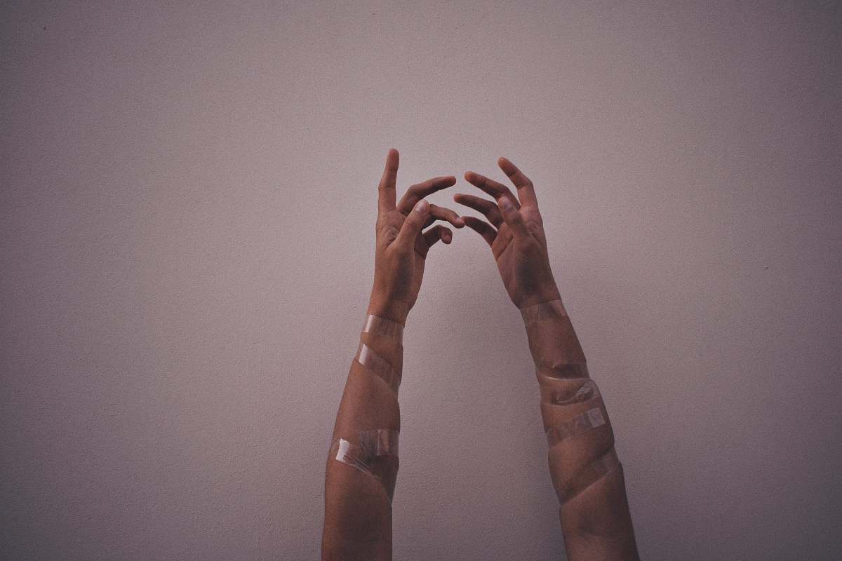 human person hands with gray wraps person