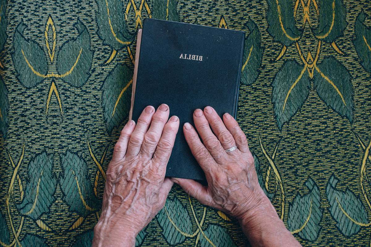 bible person holding bible book