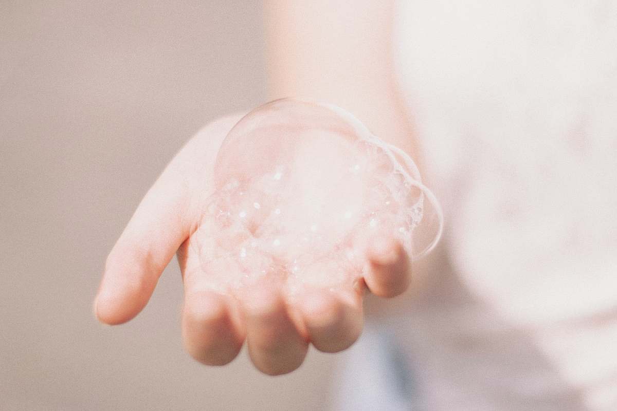 holding person holding bubbles bubbles