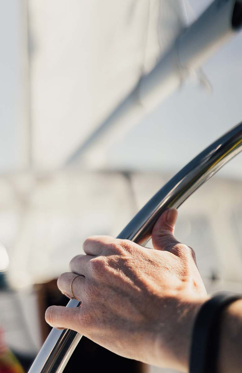wheel person holding gray metal tube steer