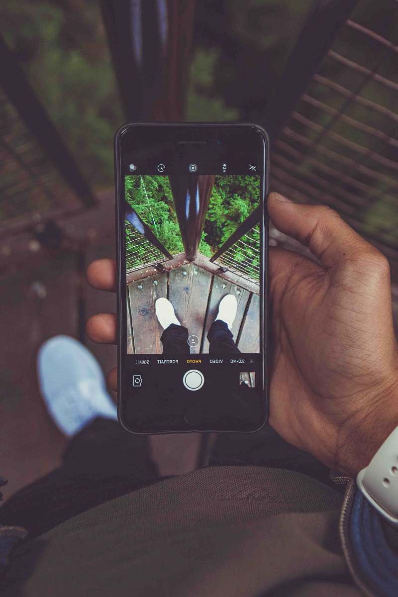 iphone person holding iPhone 6 with black case canada