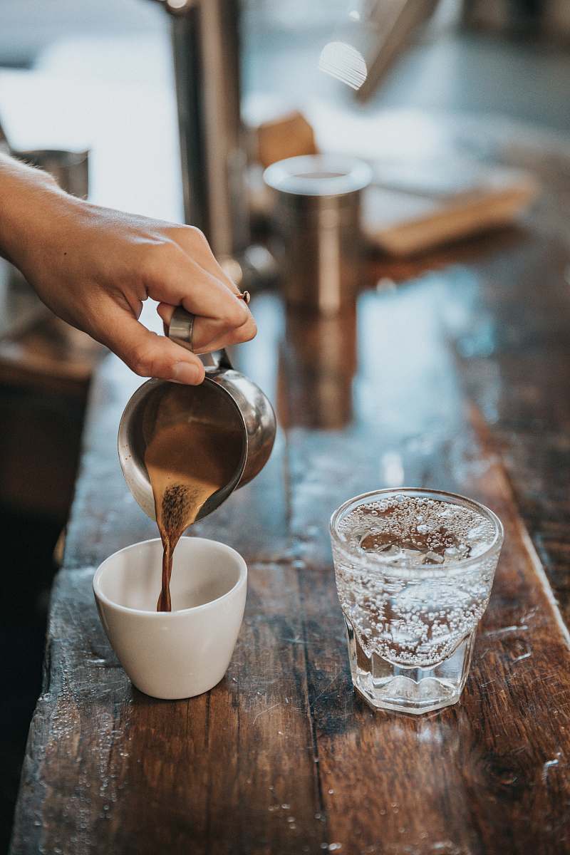 coffee person pouring coffee in mug arm