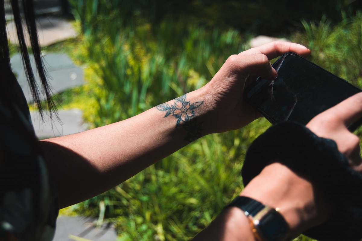 skin person using smartphone wristwatch