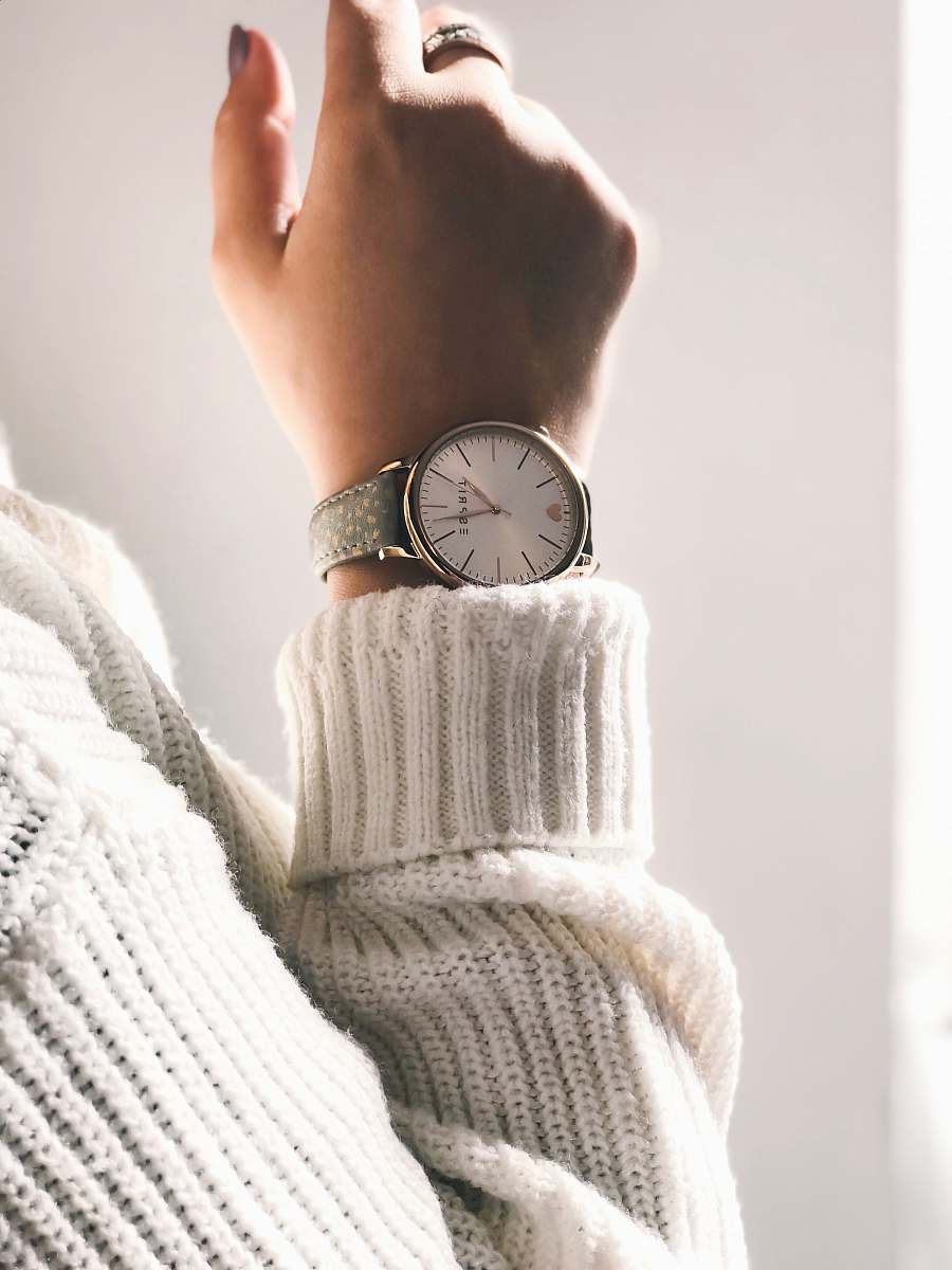 wrist person wearing round silver-colored analog watch watch