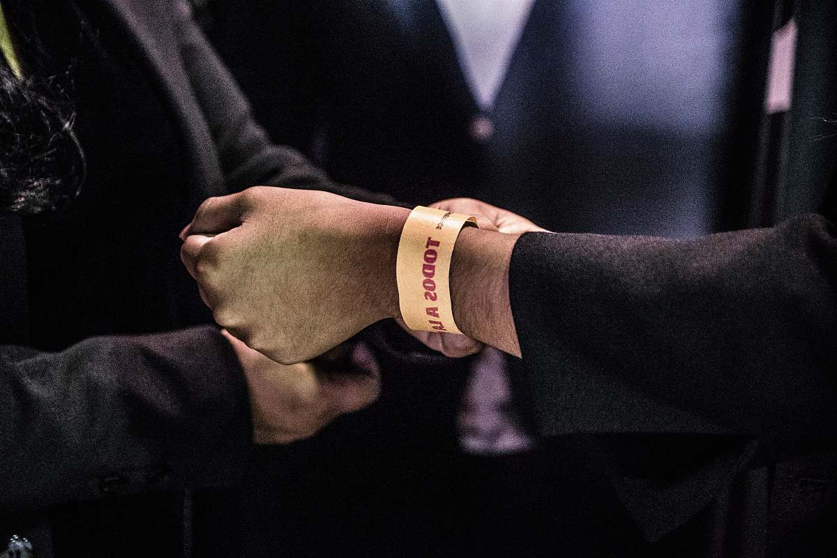 person person wearing Todos bracelet human
