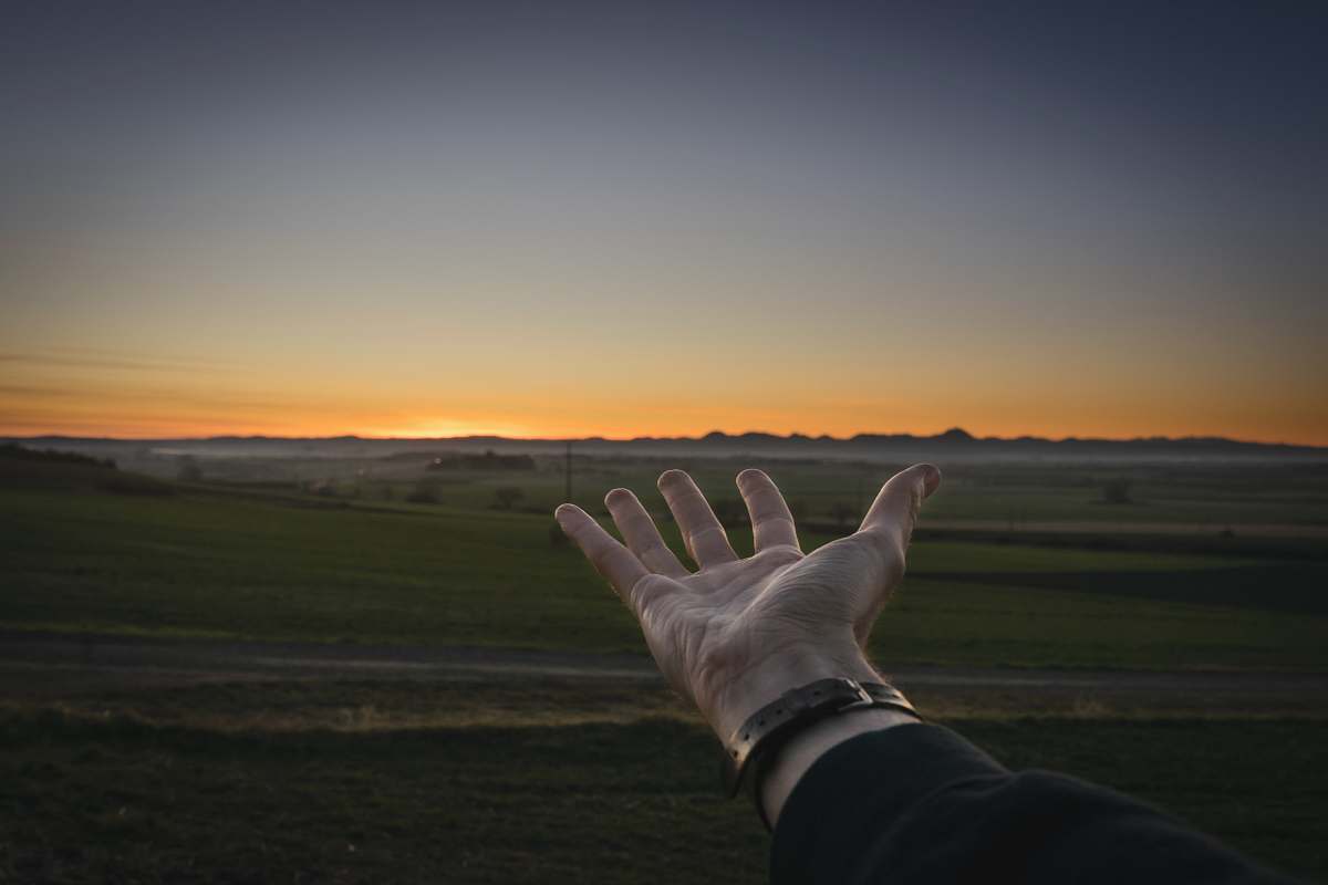 person person with left hand open during golden hour human