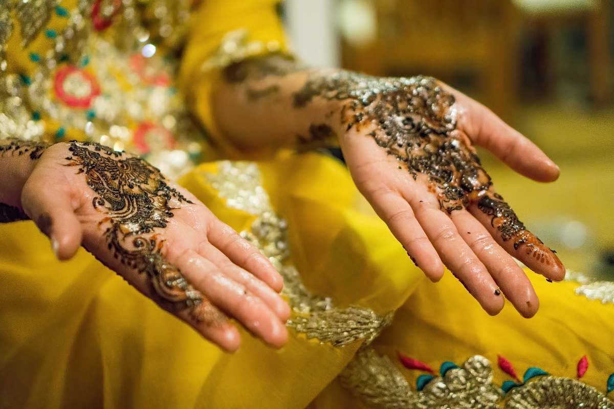 finger person's hands with mehndi tattoos henna