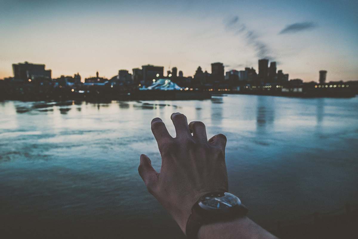 canada person's left hand reaching city scapes photography city