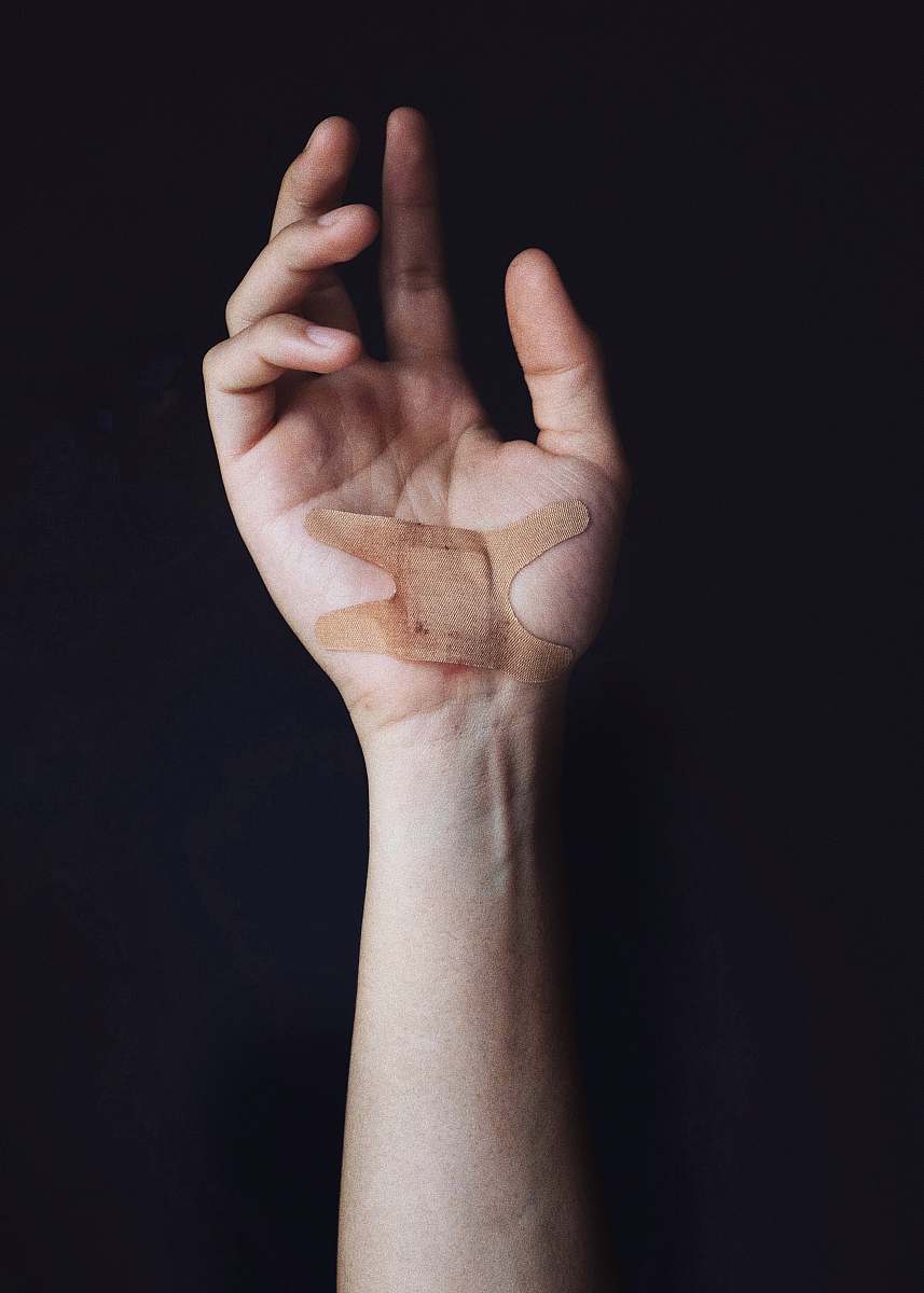 person person's left palm with bandage human