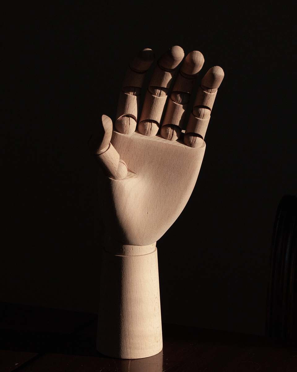 finger right human dummy hand on brown surface brown