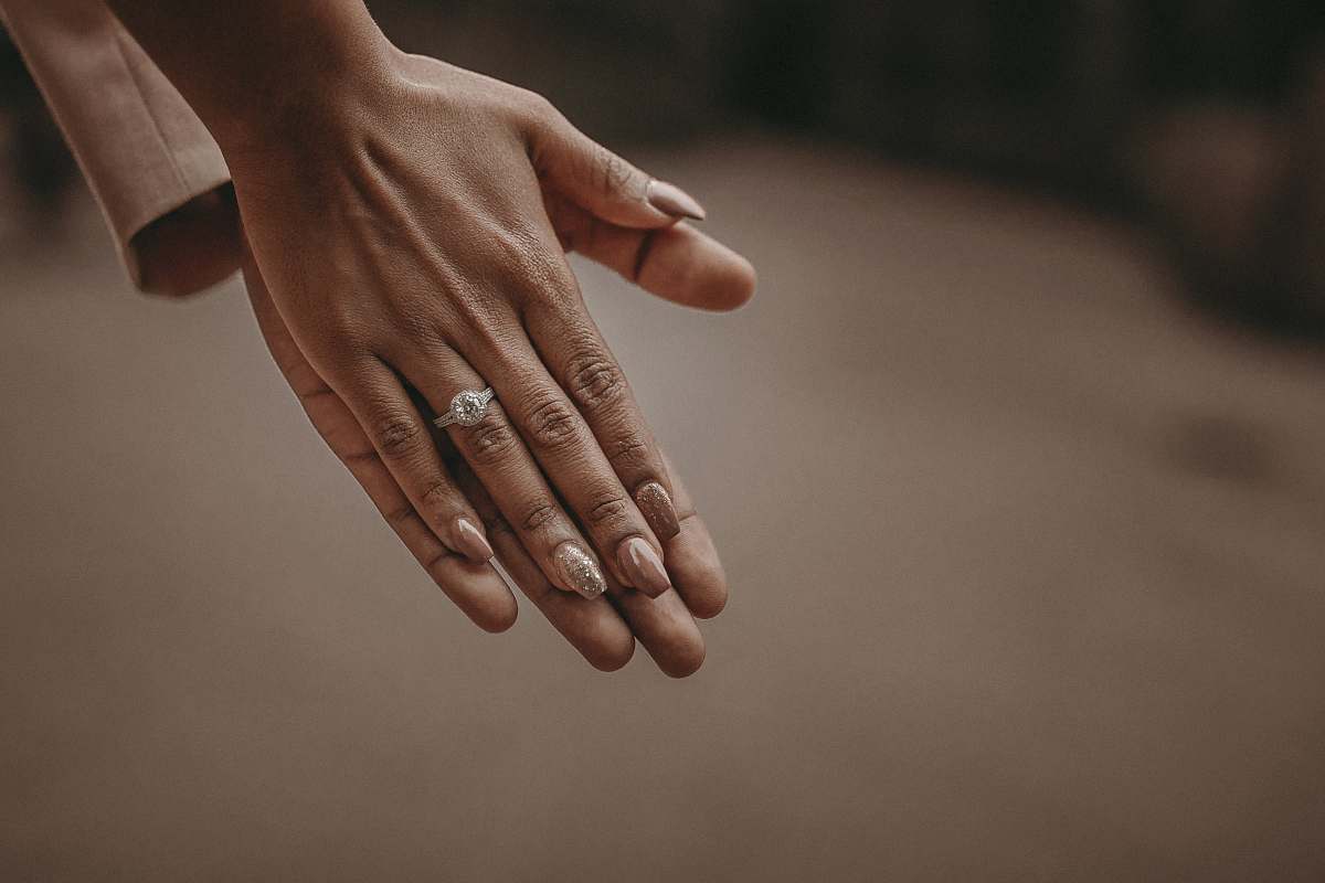 hands selective focus photography of person's hand wedding