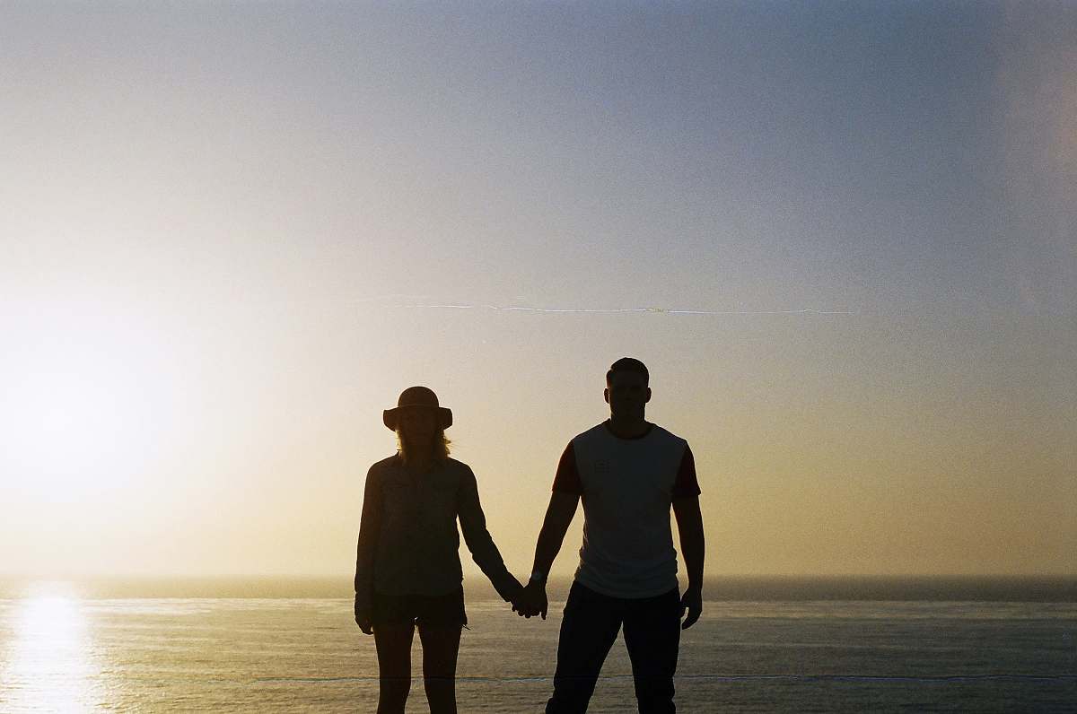 person silhouette of couple holding hands human