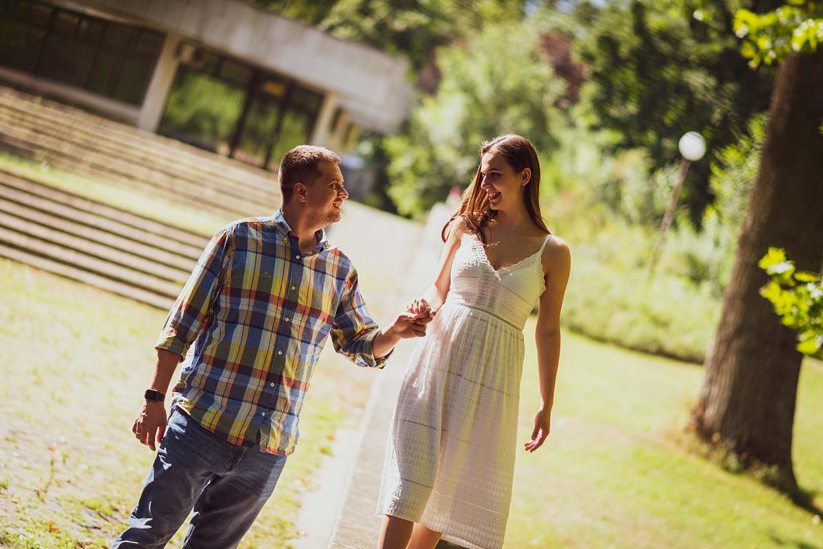 person smiling man and woman holding each other hands human